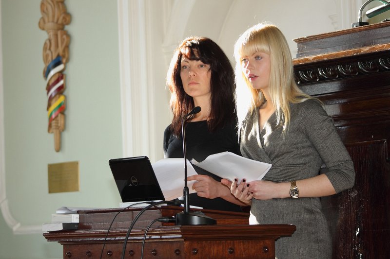 Akadēmiskā lekcija «16. marts. Kāpēc?» par Latviešu leģiona piemiņas dienas izveidi, atzīmēšanu un tās vietu Latvijas publiskajā telpā. LU doktorantes Gita Siliņa un Laura Ardava.